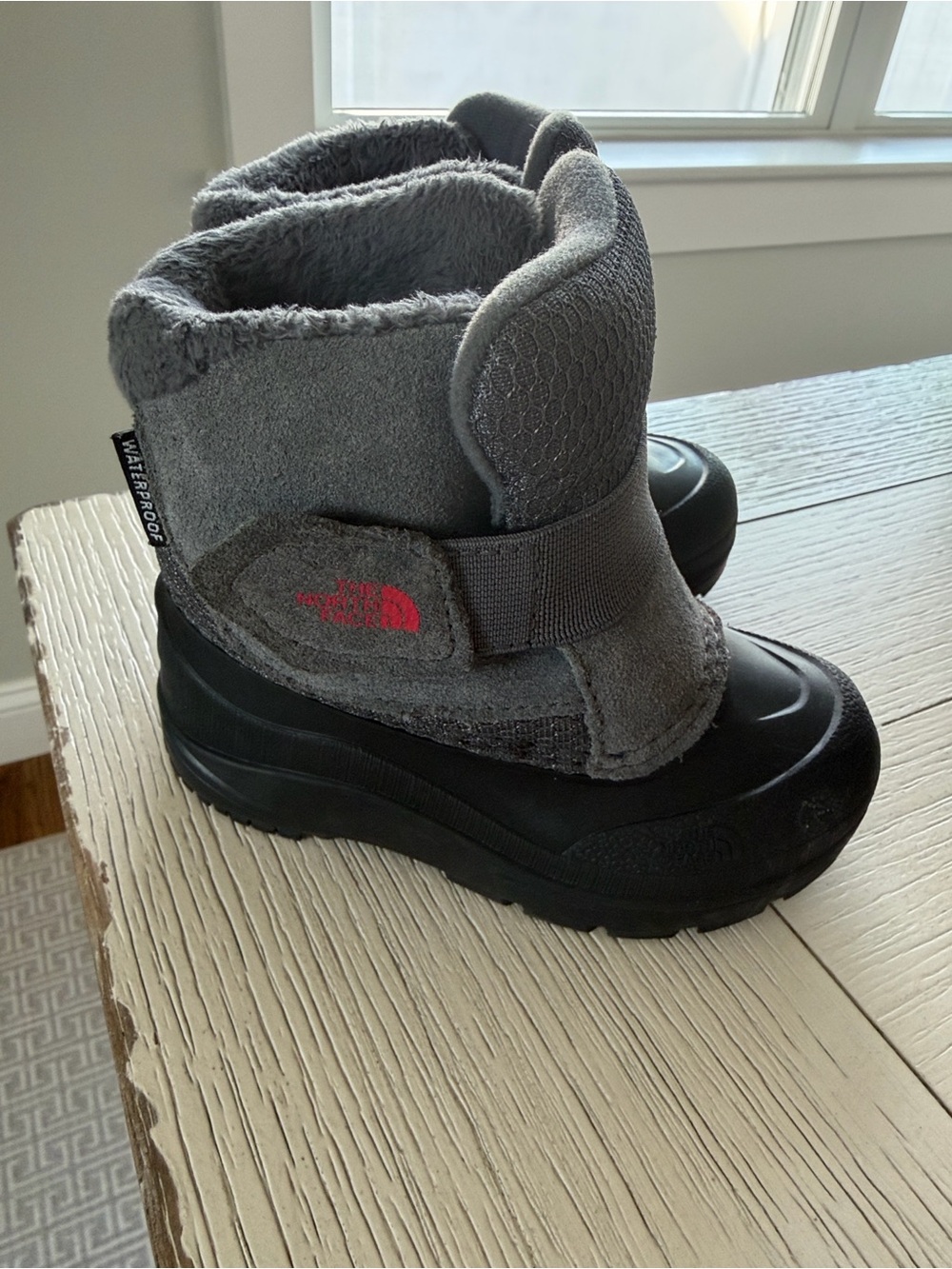 The North Face Kids Grey and Black Waterproof Snow Boots with Red Logo
